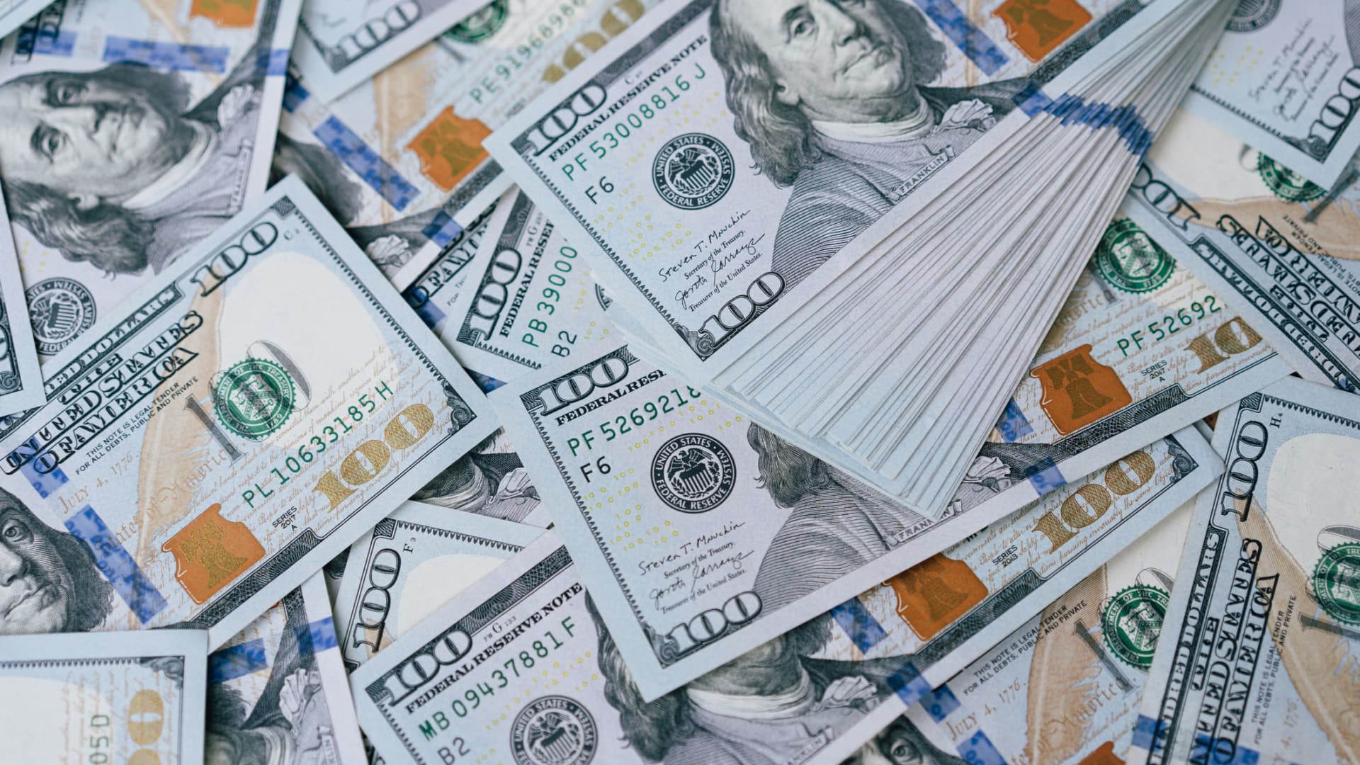Dollar bides times as markets brace for Ukraine summit